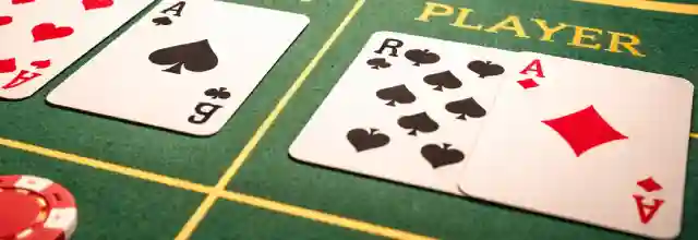 Baccarat table with cards and chips in a casino setting